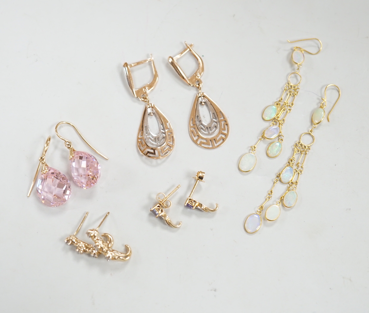 Two modern pairs of 14k drop earrings including pink cubic zirconia, 15mm, gross weight 10.1 grams, two similar pairs of 10k and gem set earrings, gross weight 2.7 grams and a modern pair of yellow metal and opal cluster